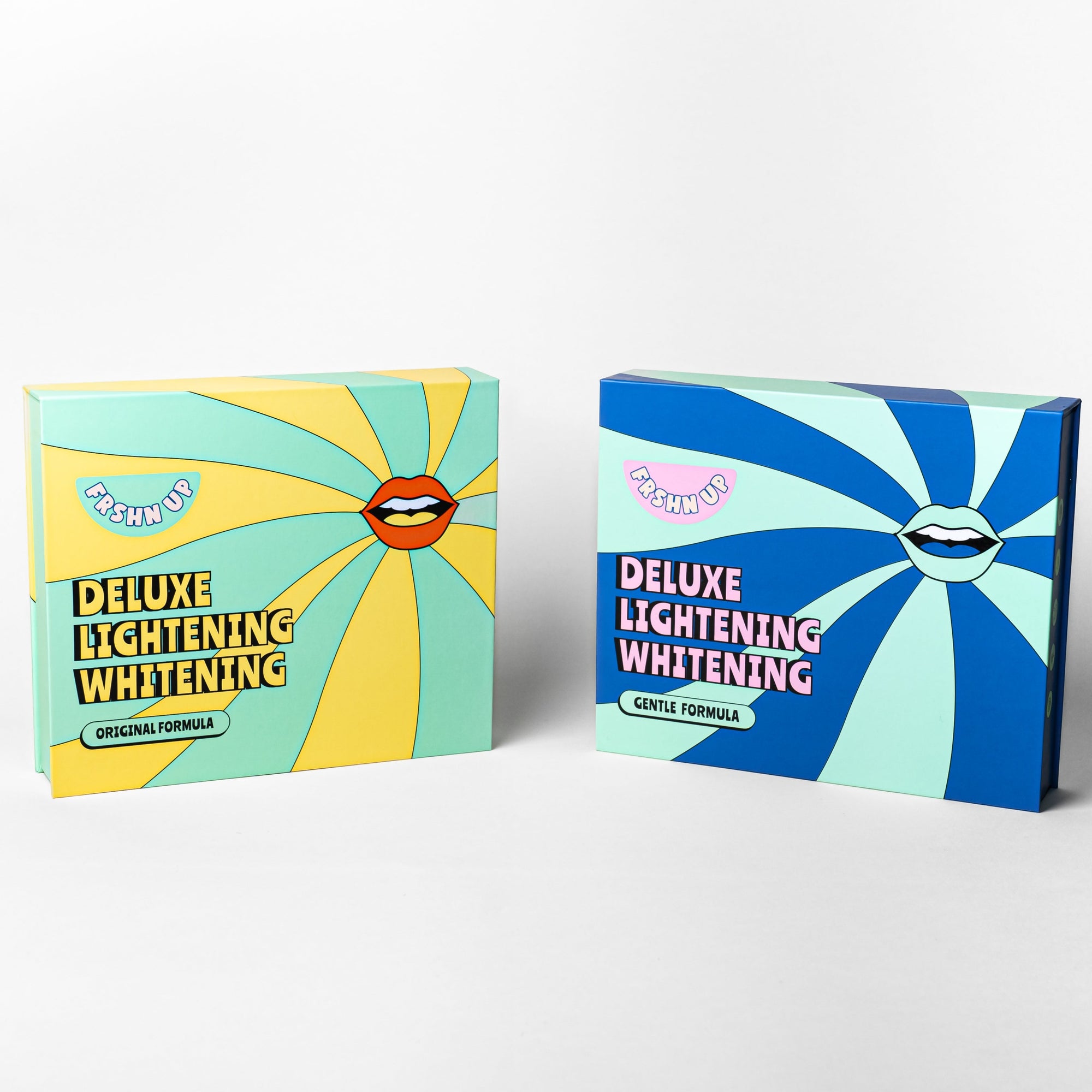 Two blue and yellow boxes with a smiley face on them, perfect for Family or friends looking for pearly-whites-brightening solutions in our FRSHN UP Brightening Bundle.