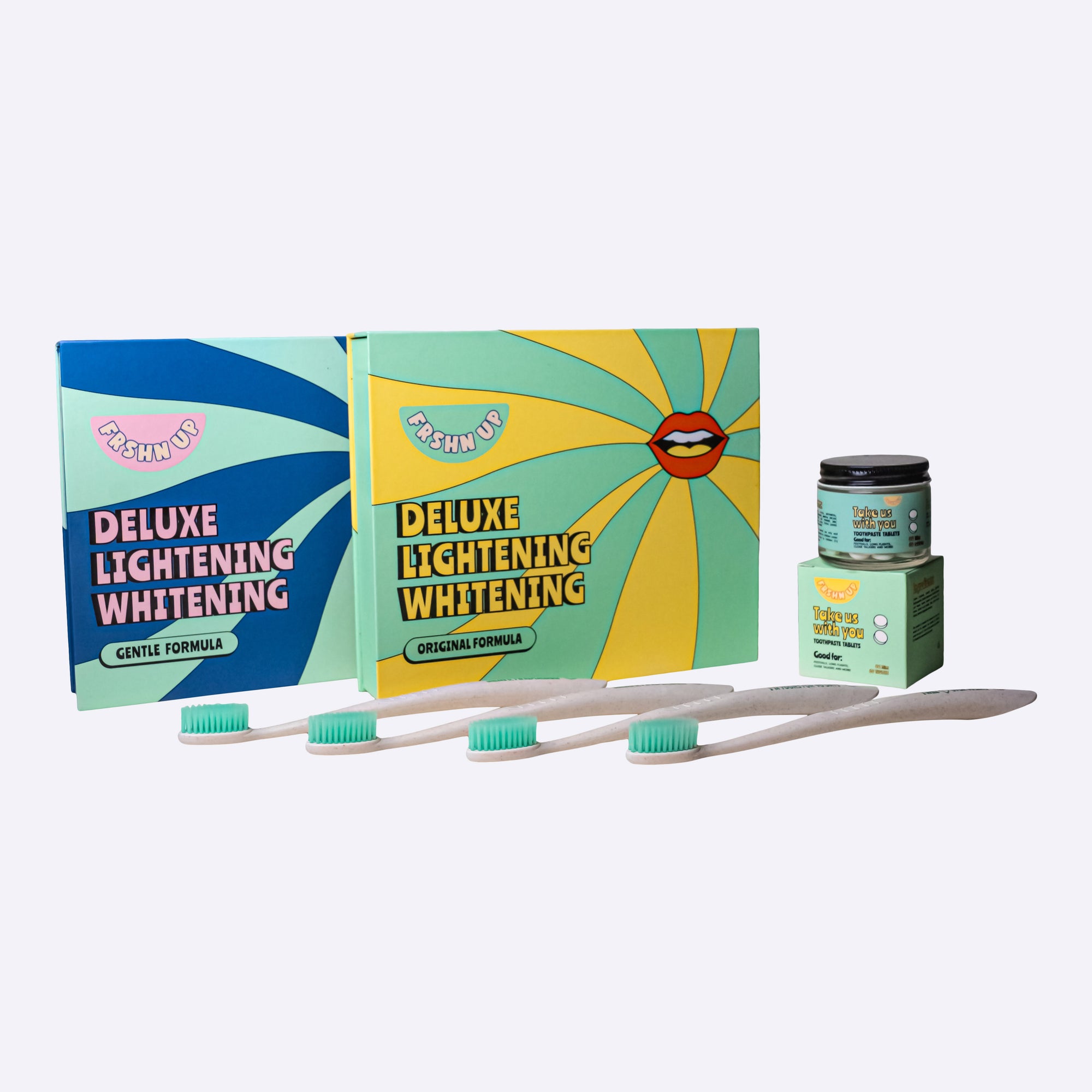 A box of pearly-whites-brightening toothbrushes and a box of toothpaste to give your family or friends the gift of good vibes with our FRSHN UP Family Brightening Bundle.