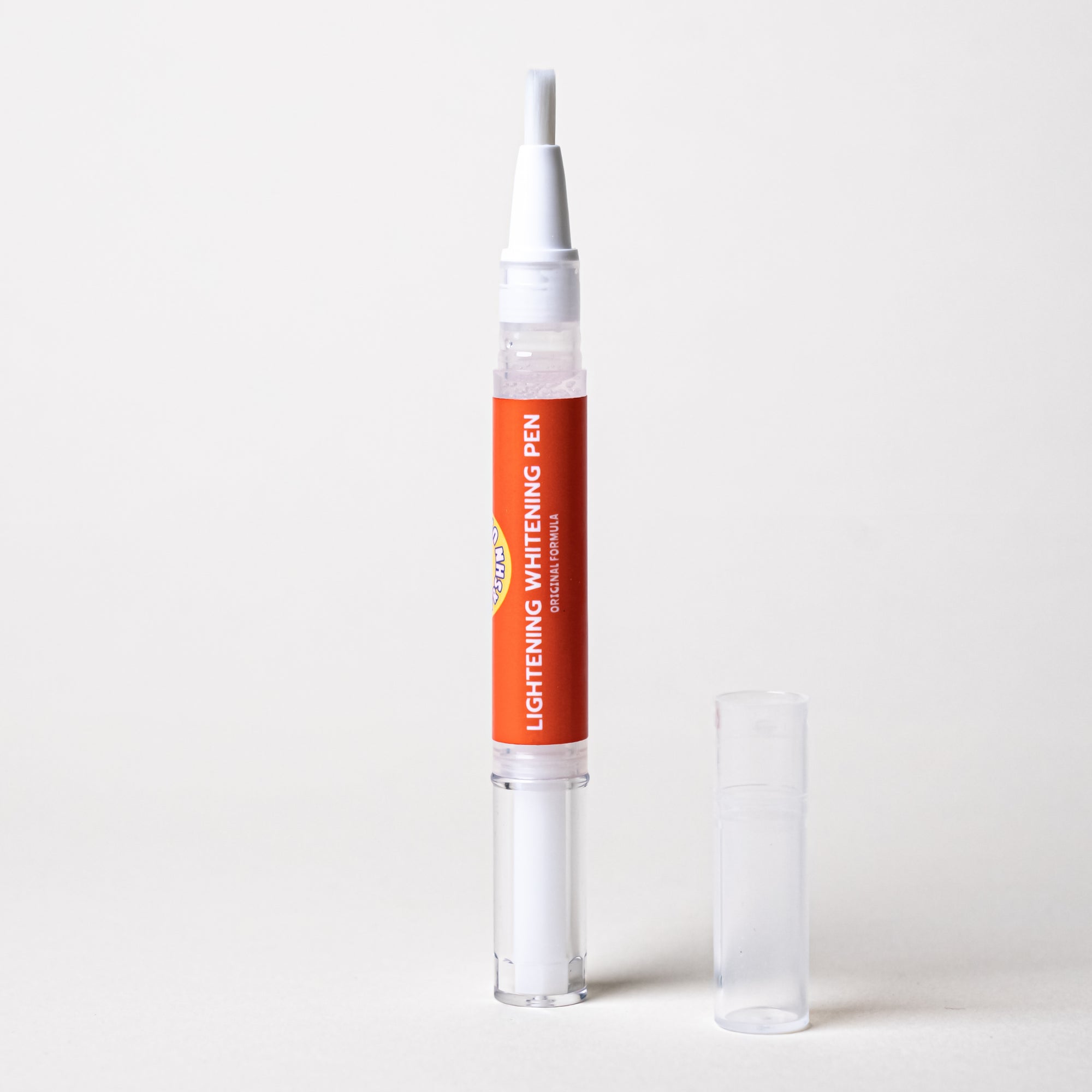 A fast-acting FRSHN UP Lightening Whitening Pen - Original Formula - 2-pack with an orange tube and a white tube next to it.